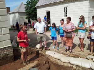 Karen discusses their excavation with students and visitors