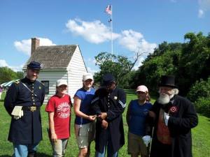Me, Lauren, and Mariana pose with re-enactors in front of the Surveyor's Shed!